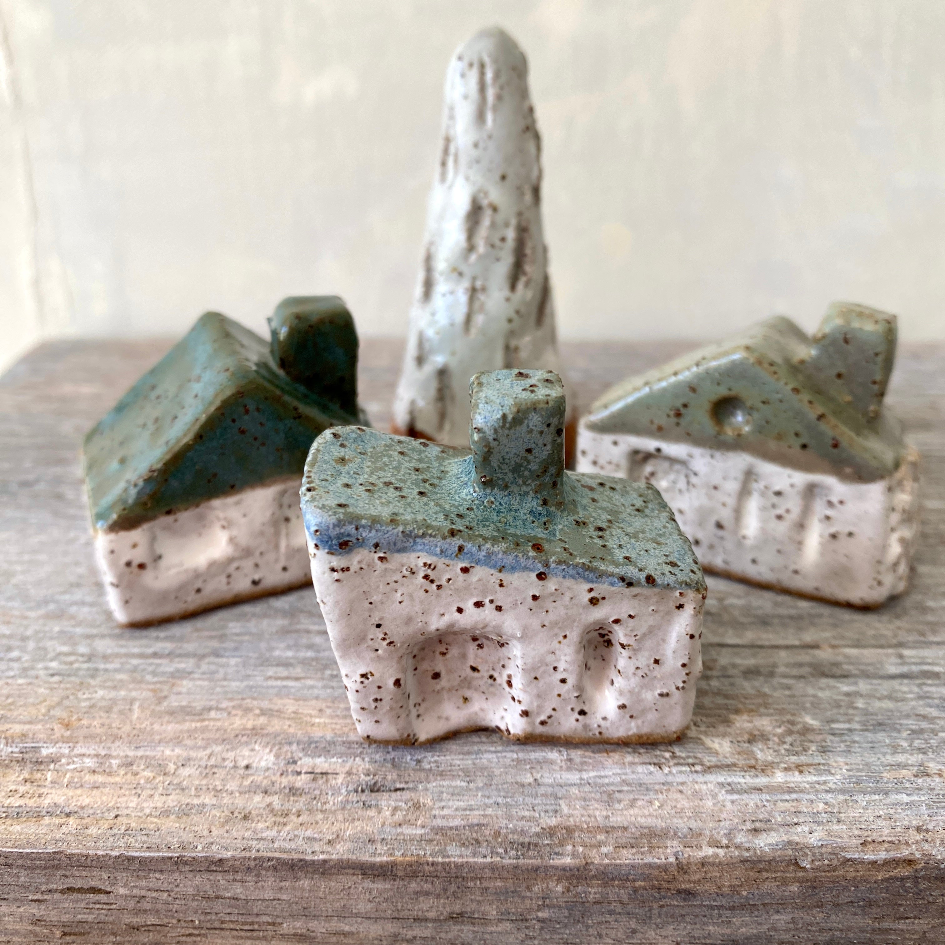 A village of cute tiny cottages plus a little tree