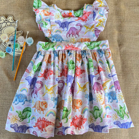 Handmade toddler pinafore / dress | bright dinosaurs