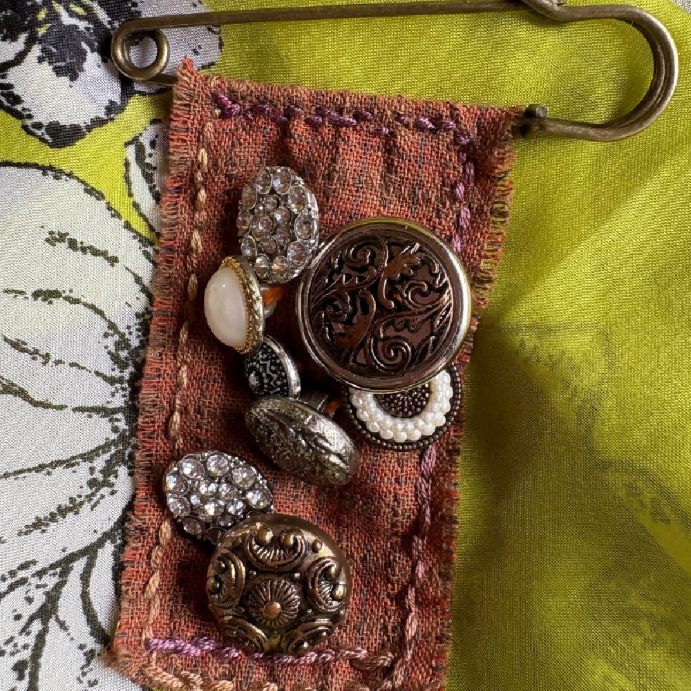 Buttoned and hand stitched brooch by Leumesin Handmade