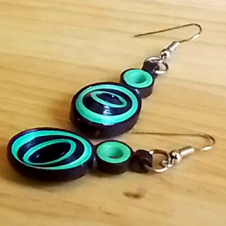 Handmade quilled turquoise and black oval skewed earrings