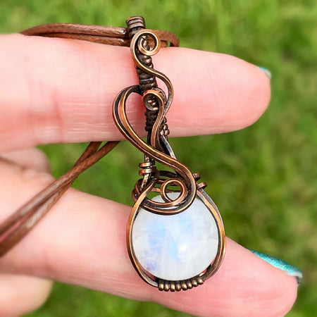 Captivating 47x17mm Wire-Wrapped Rainbow Moonstone Pendant