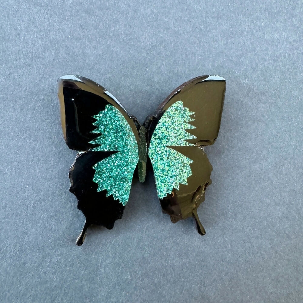 Australian-handmade-ulysses-butterfly-brooch-wood-glitter-resin-on-grey-background-square