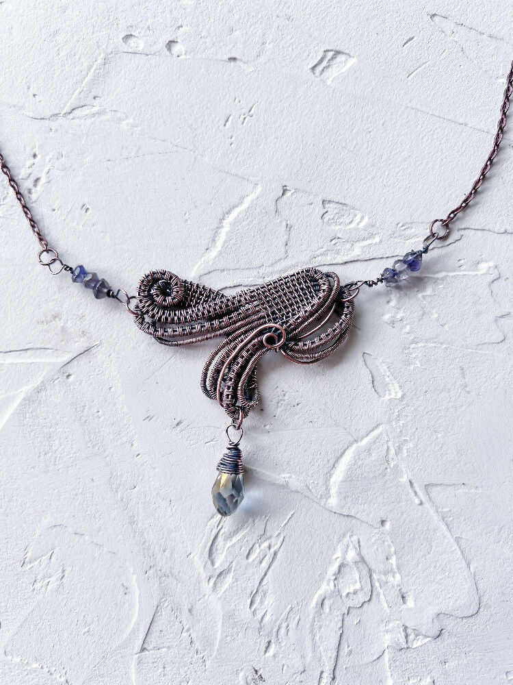 Sophisticated Wire Woven Pendant with Iolite Accents