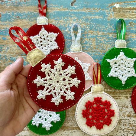 Christmas baubles with a crochet snowflakes