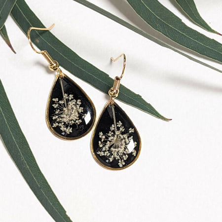 Dainty teardrop Queen Anne's Lace earrings black background