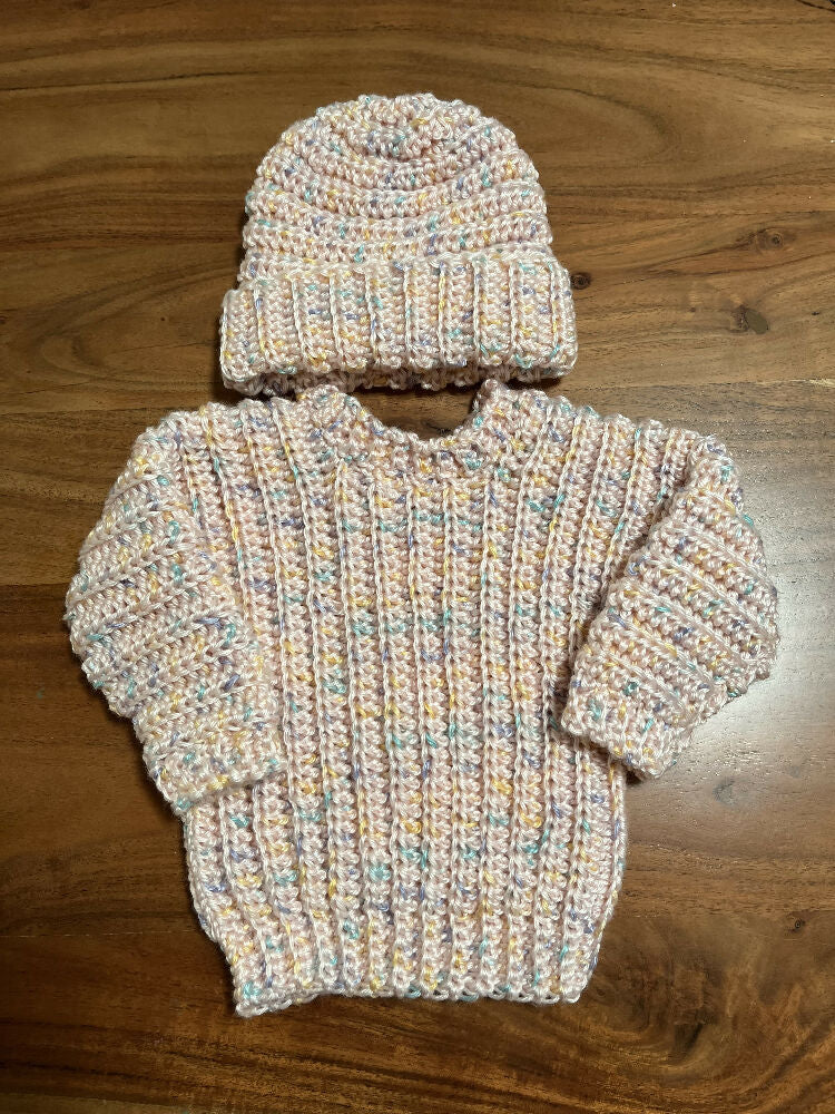 Hand crocheted baby’s jumper and matching beanie