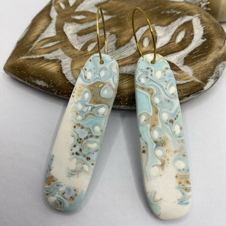 long drop pastel ocean theme earrings on gold hoops