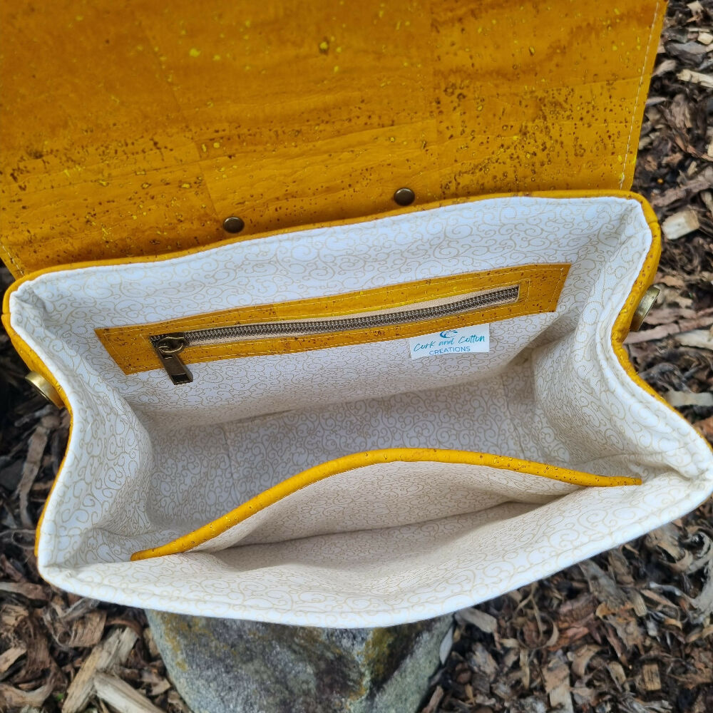 Interior view of cork backpack showing a light, patterned cotton interior.