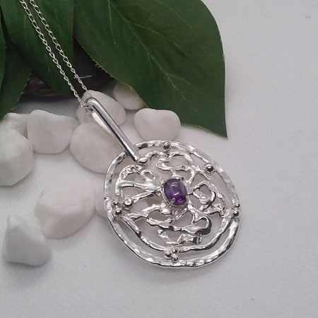 Sterling silver pendant with amethyst cabochon