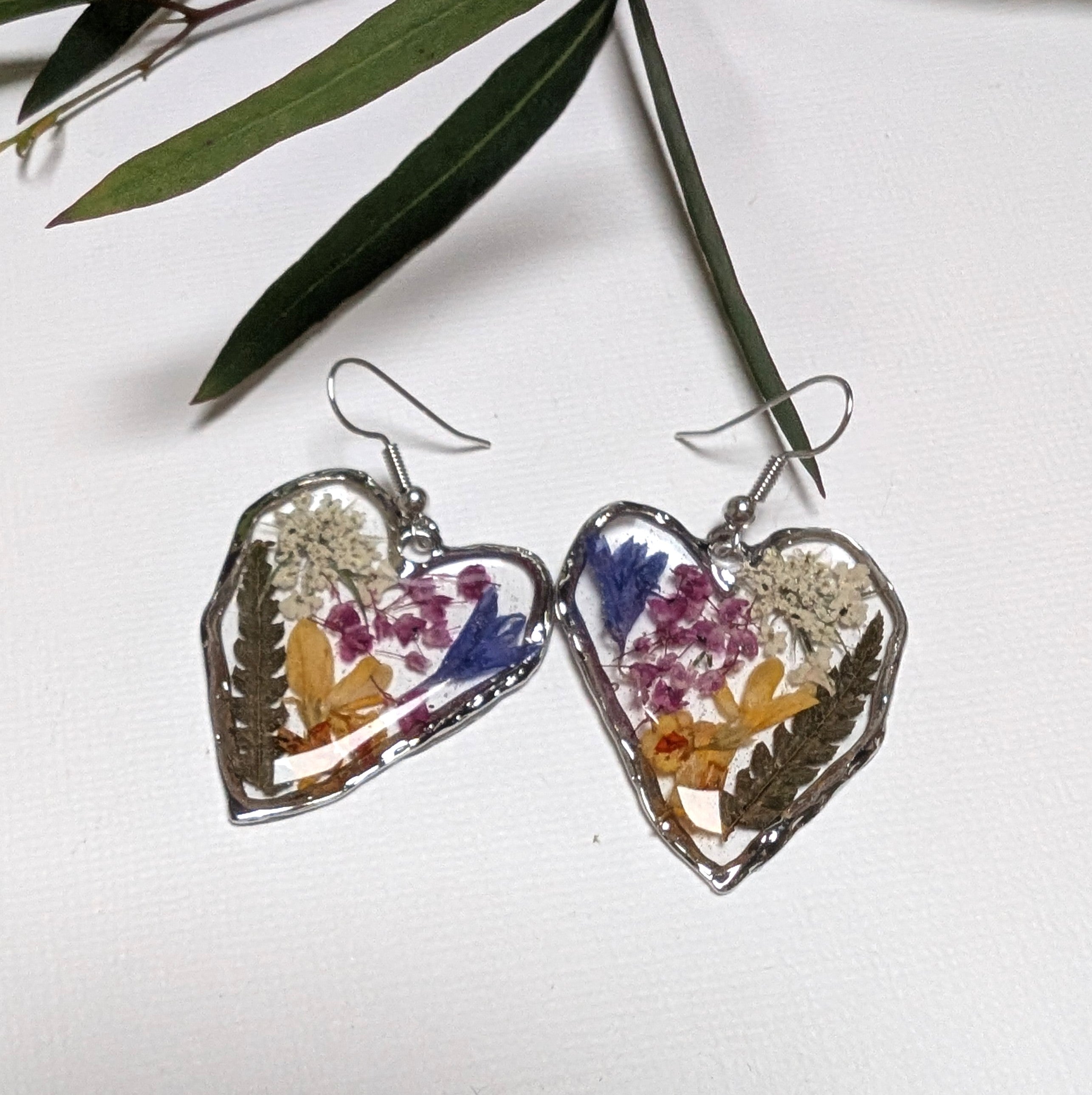 Pressed flowers in resin, heart-shaped, wildflowers