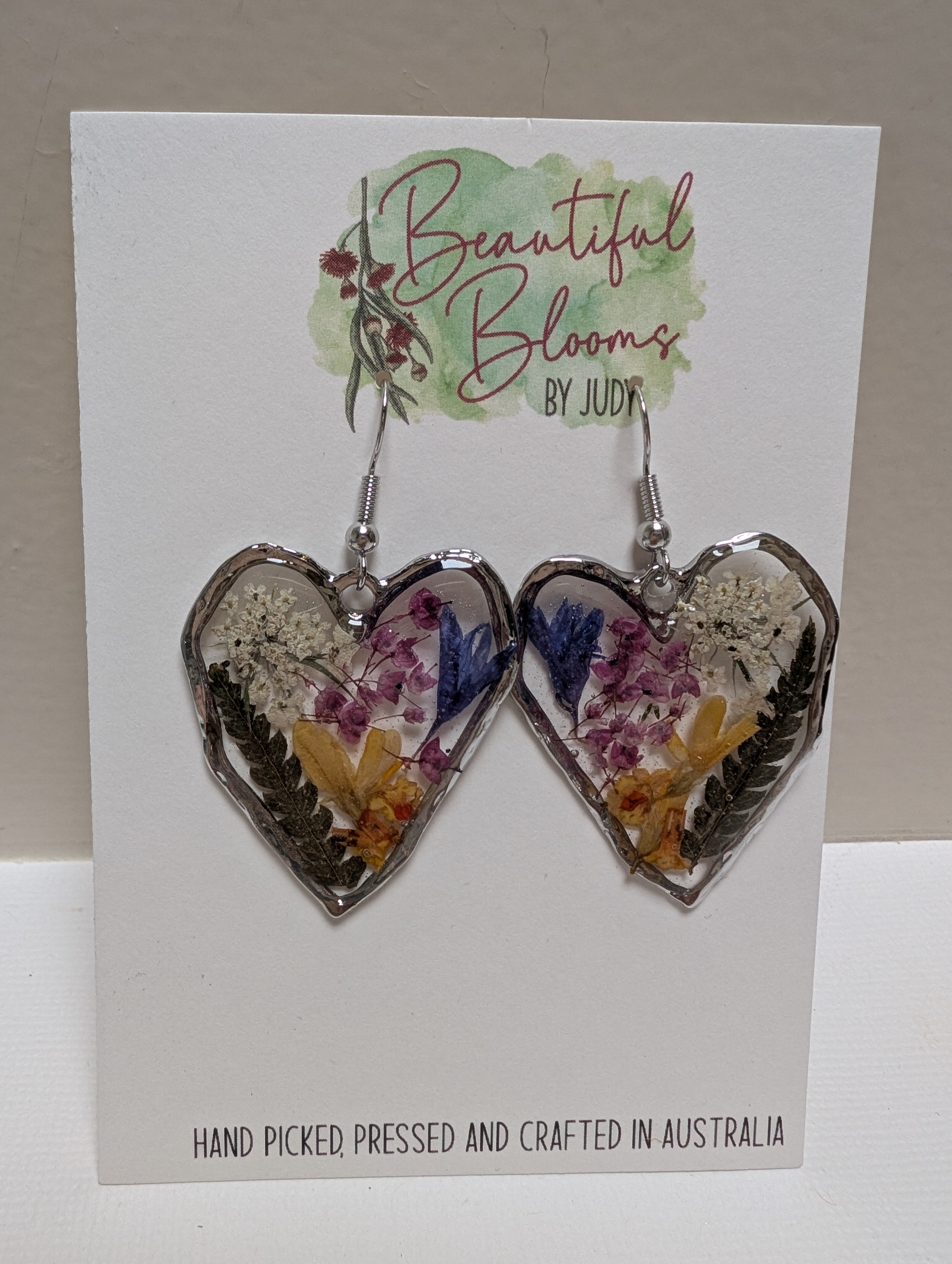 Pressed flowers in resin, heart-shaped, wildflowers