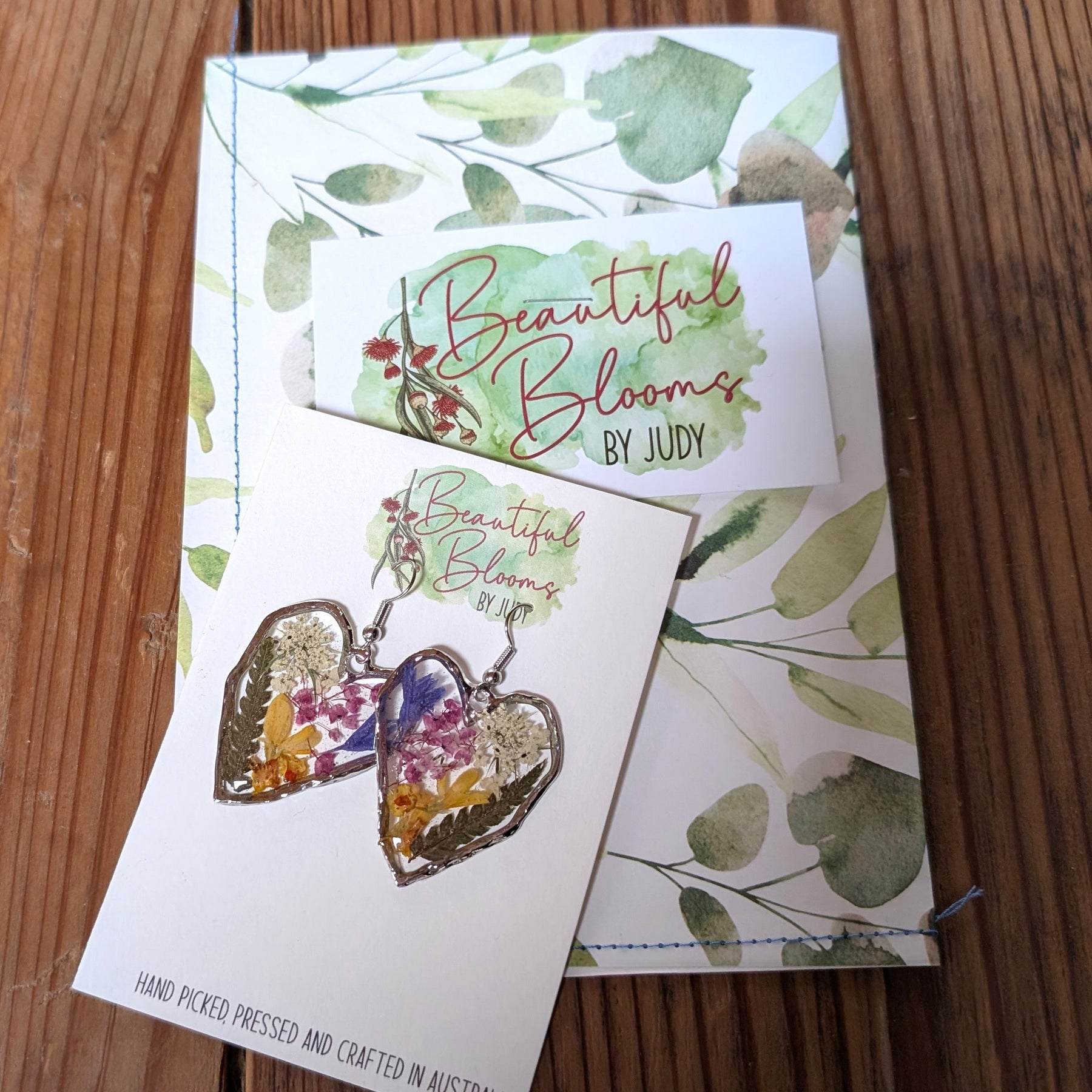 Pressed flowers in resin, heart-shaped, wildflowers