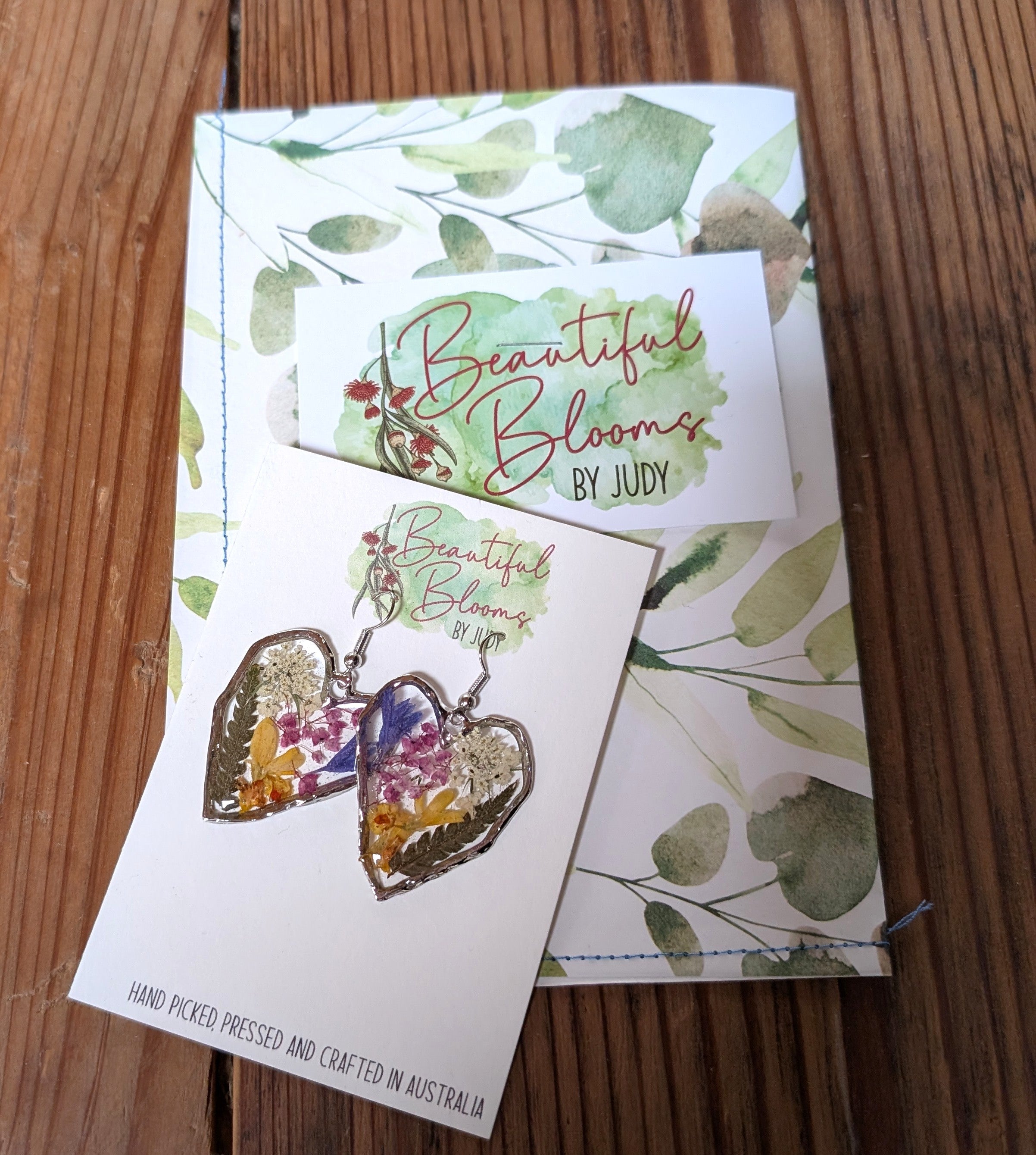 Pressed flowers in resin, heart-shaped, wildflowers
