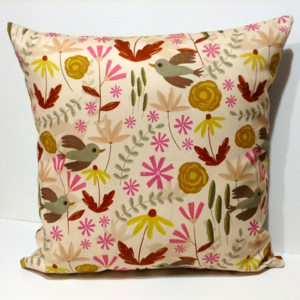 Beige floral cushion cover with bird detail.