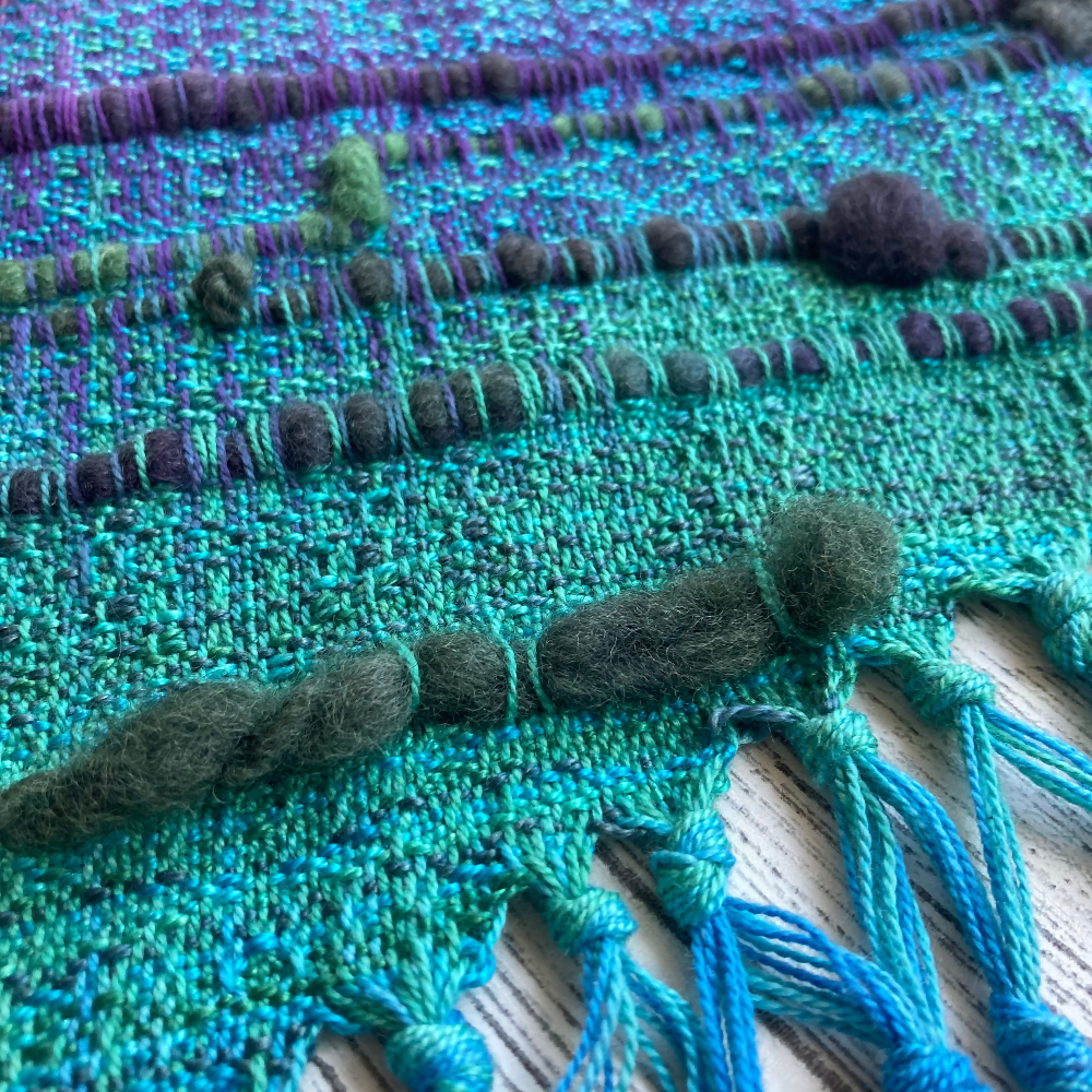 handwoven-wall-hanging-rainbow-entangled-happiness-handwovens-closeup-texture-fringe