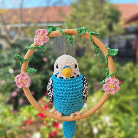 crocheted blue budgie on a swing, room decoration