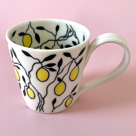 Handmade porcelain ceramic cup with lemon design