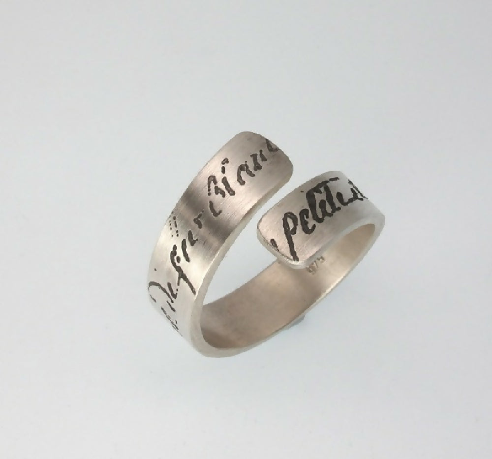 Manu Scriptum wrap ring viewed on an angle