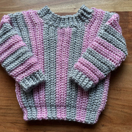 Hand crocheted baby’s jumper pink and grey