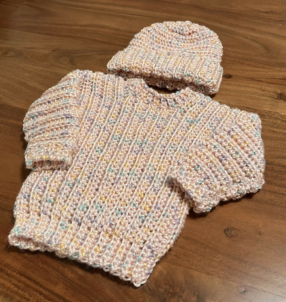 Hand crocheted baby’s jumper and matching beanie