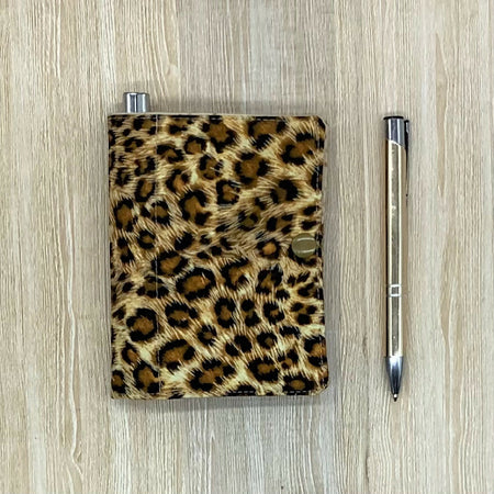 Leopard Spot refillable fabric pocket notepad cover with snap closure. Incl. book and pen.