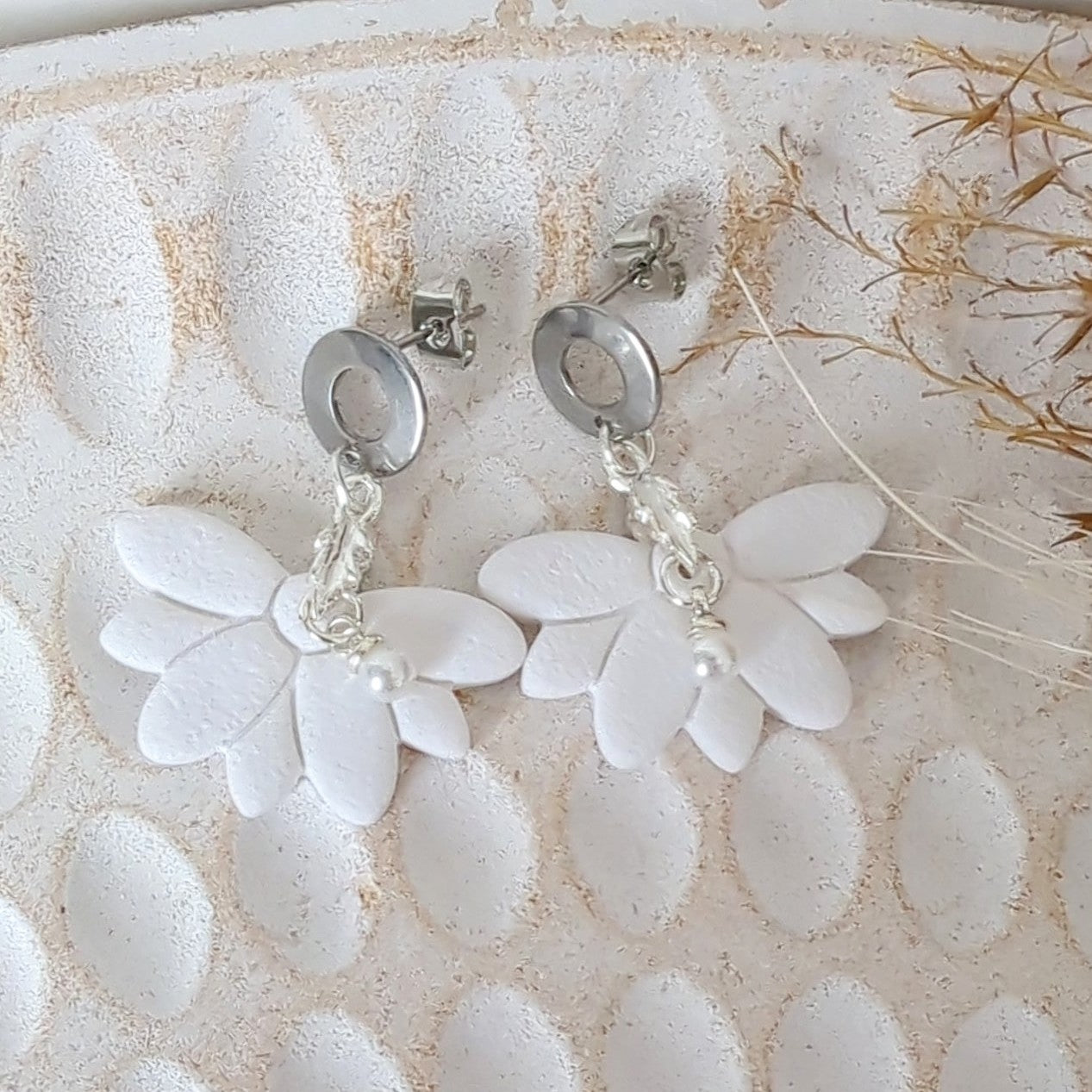 White Earrings with Silver in Different Designs.