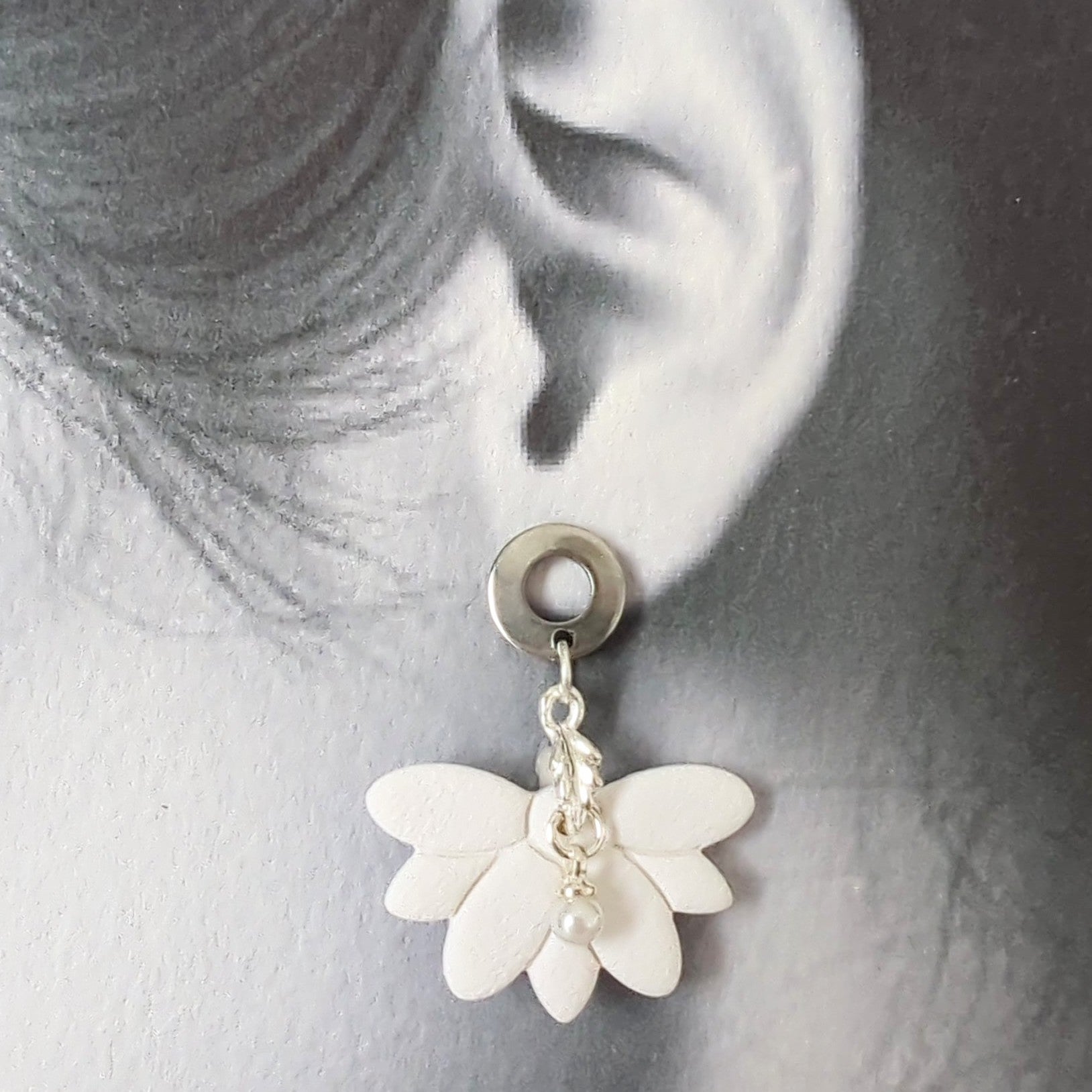 White Earrings with Silver in Different Designs.