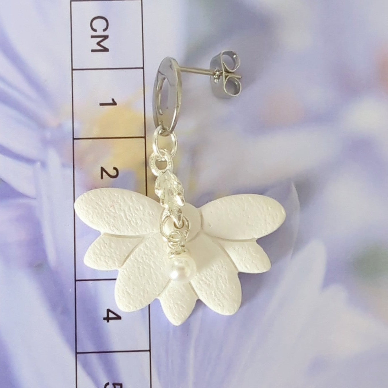 White Earrings with Silver in Different Designs.