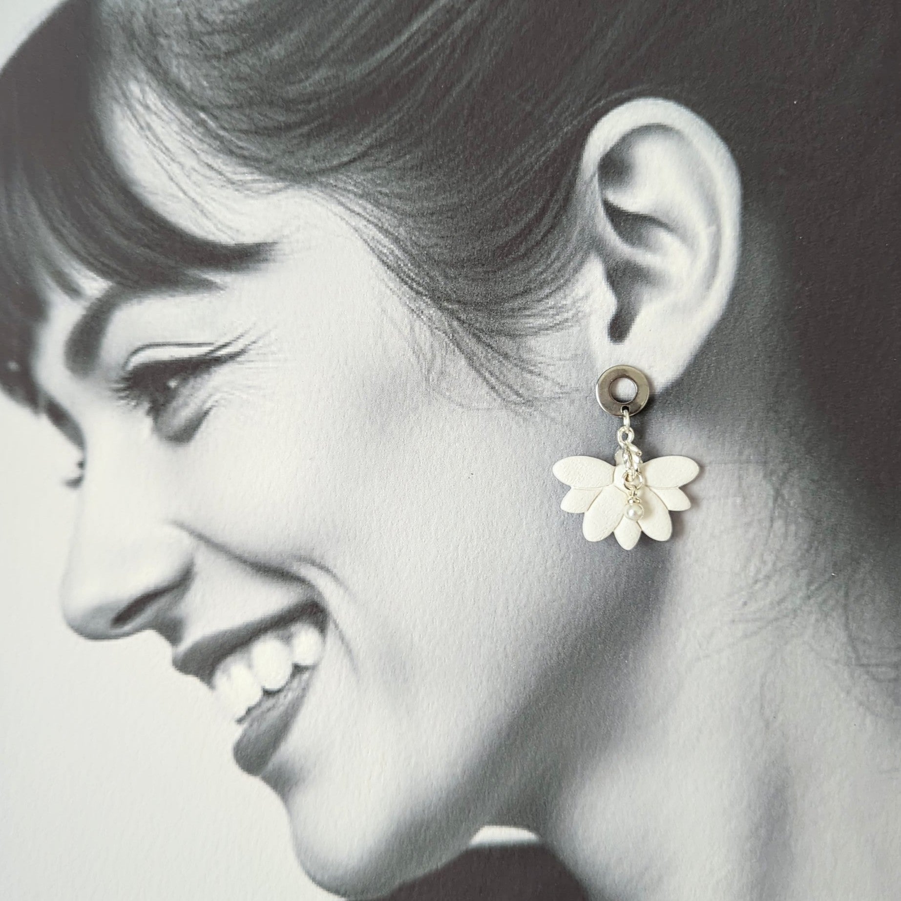 White Earrings with Silver in Different Designs.