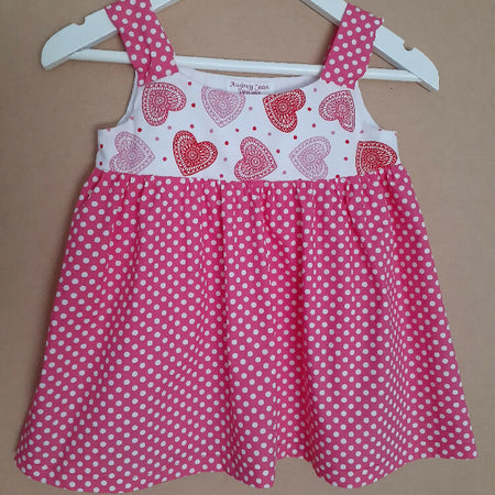 Cute child's dresses sizes 1-6. One-Of-A-Kind Print Bodice with Contrasting Spotty Skirt & Straps.