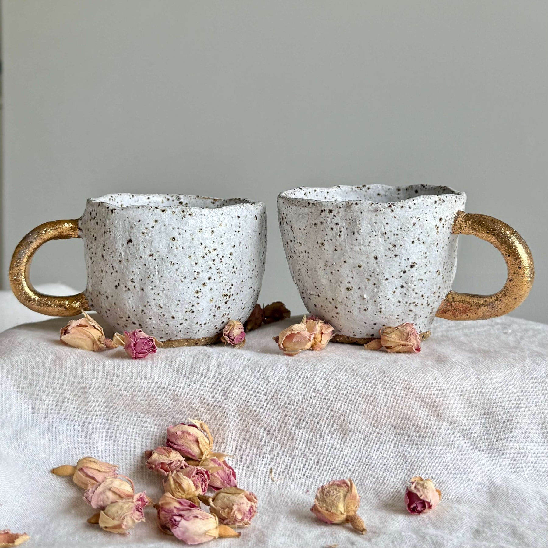 Handmade Ceramic Pinch Pot Cup | White Speckled Mug with Gold Handle | 200ml