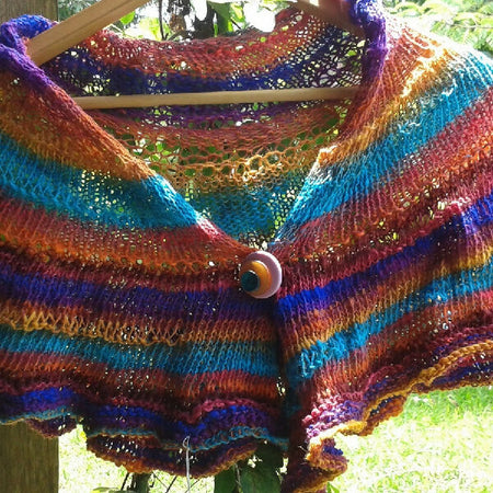 Knitted wrap made from bright silk blend yarn