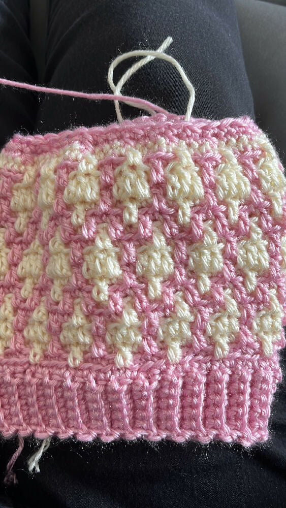 Pink and white children’s beanie