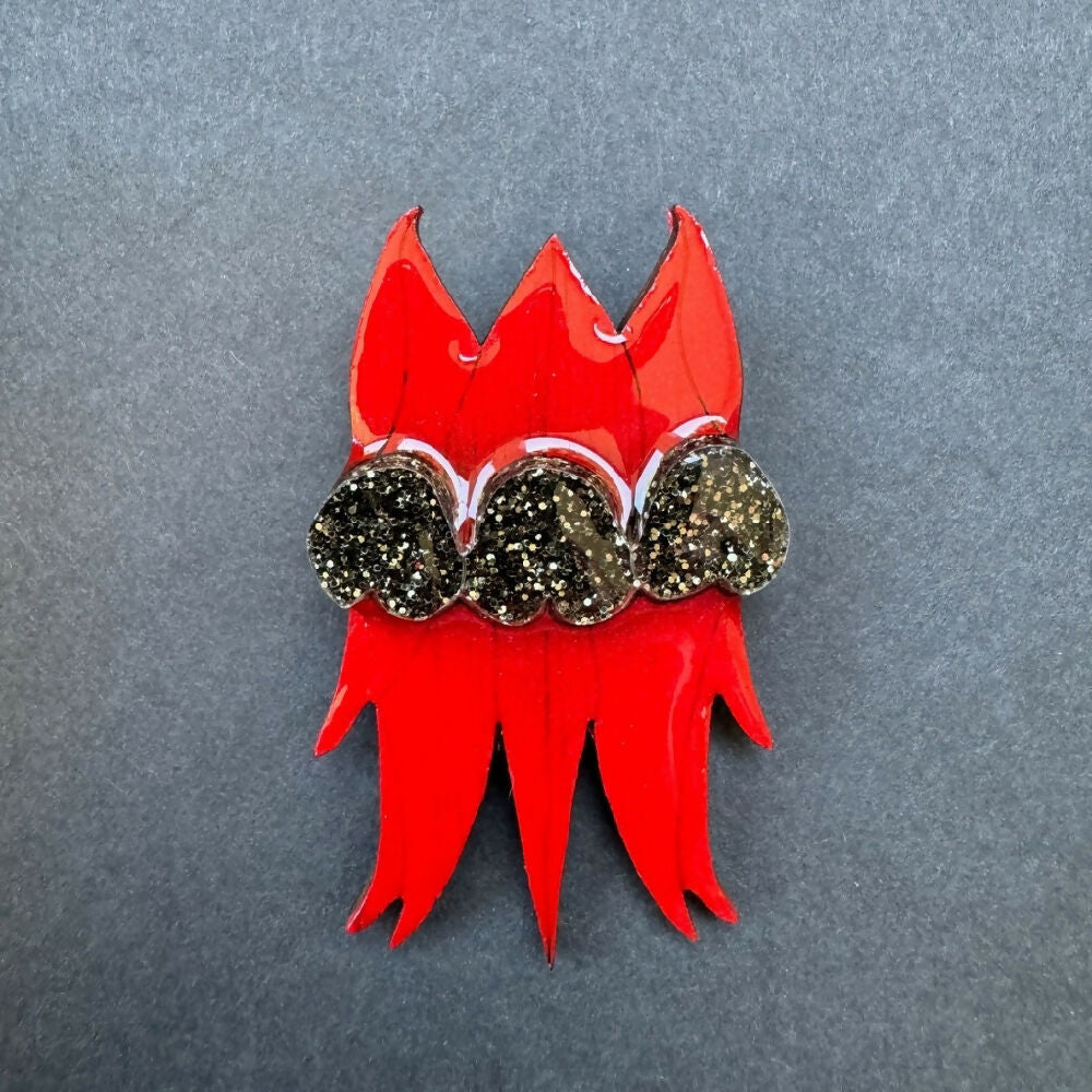 Australian-handmade-sturt-desert-pea-brooch-wood-glitter-resin-on-grey-background-square