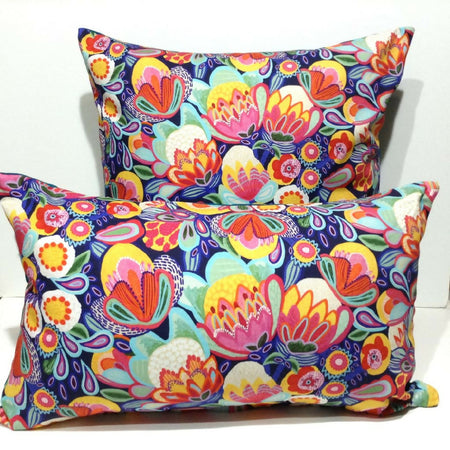 Bright blue, pink and yellow native floral cushion cover