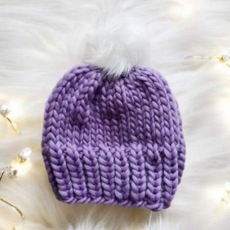 Super chunky hand knit merino wool purple beanie with faux fur pompom