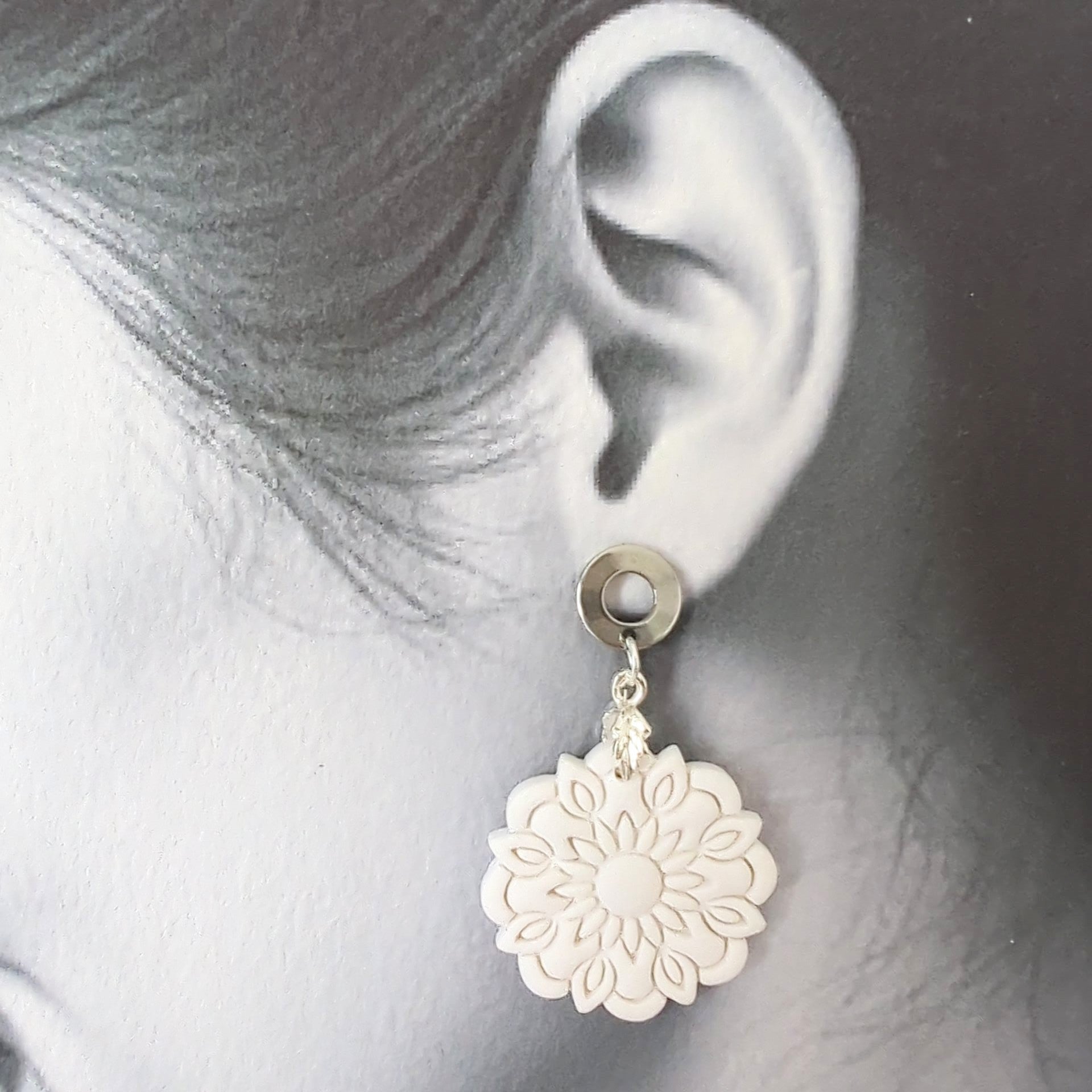 White Earrings with Silver in Different Designs.