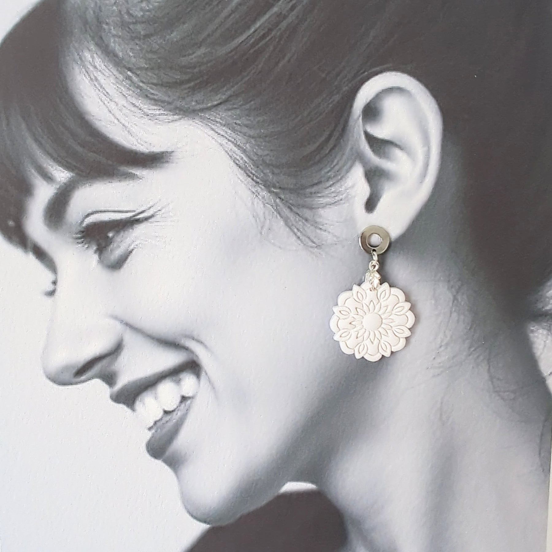 White Earrings with Silver in Different Designs.