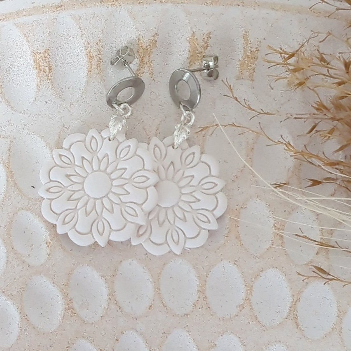 White Earrings with Silver in Different Designs.