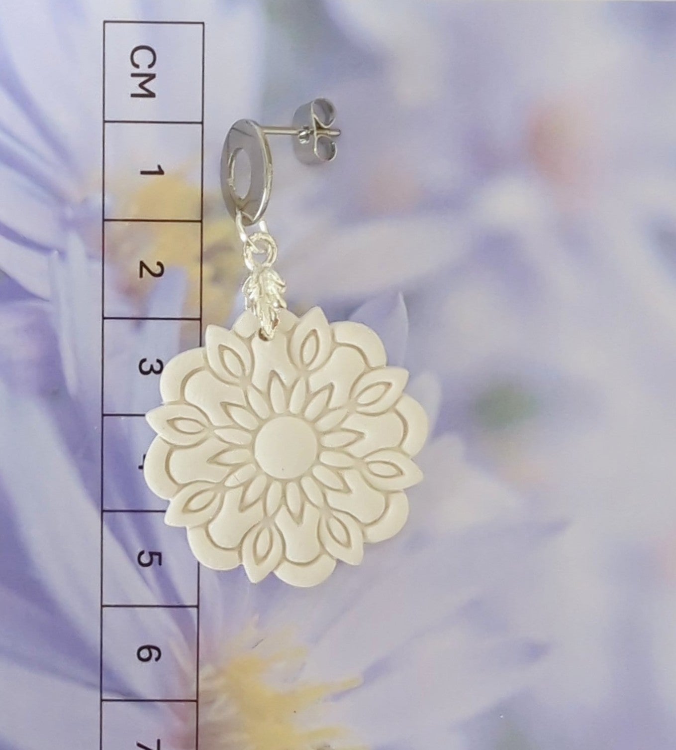 White Earrings with Silver in Different Designs.