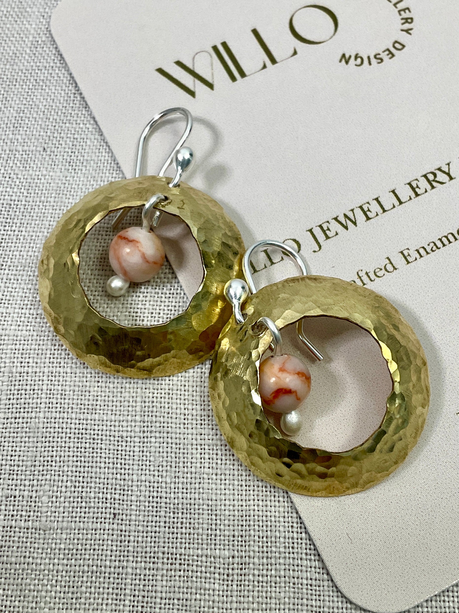 Brass domed earrings with gemstones.