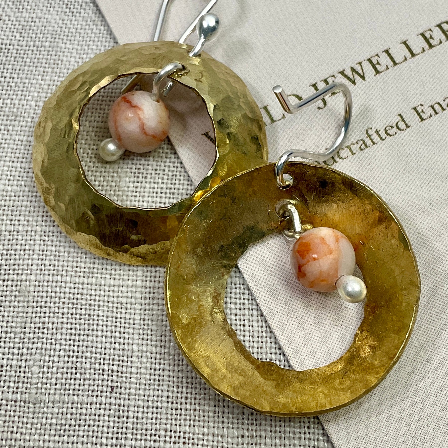 Brass domed earrings with gemstones.