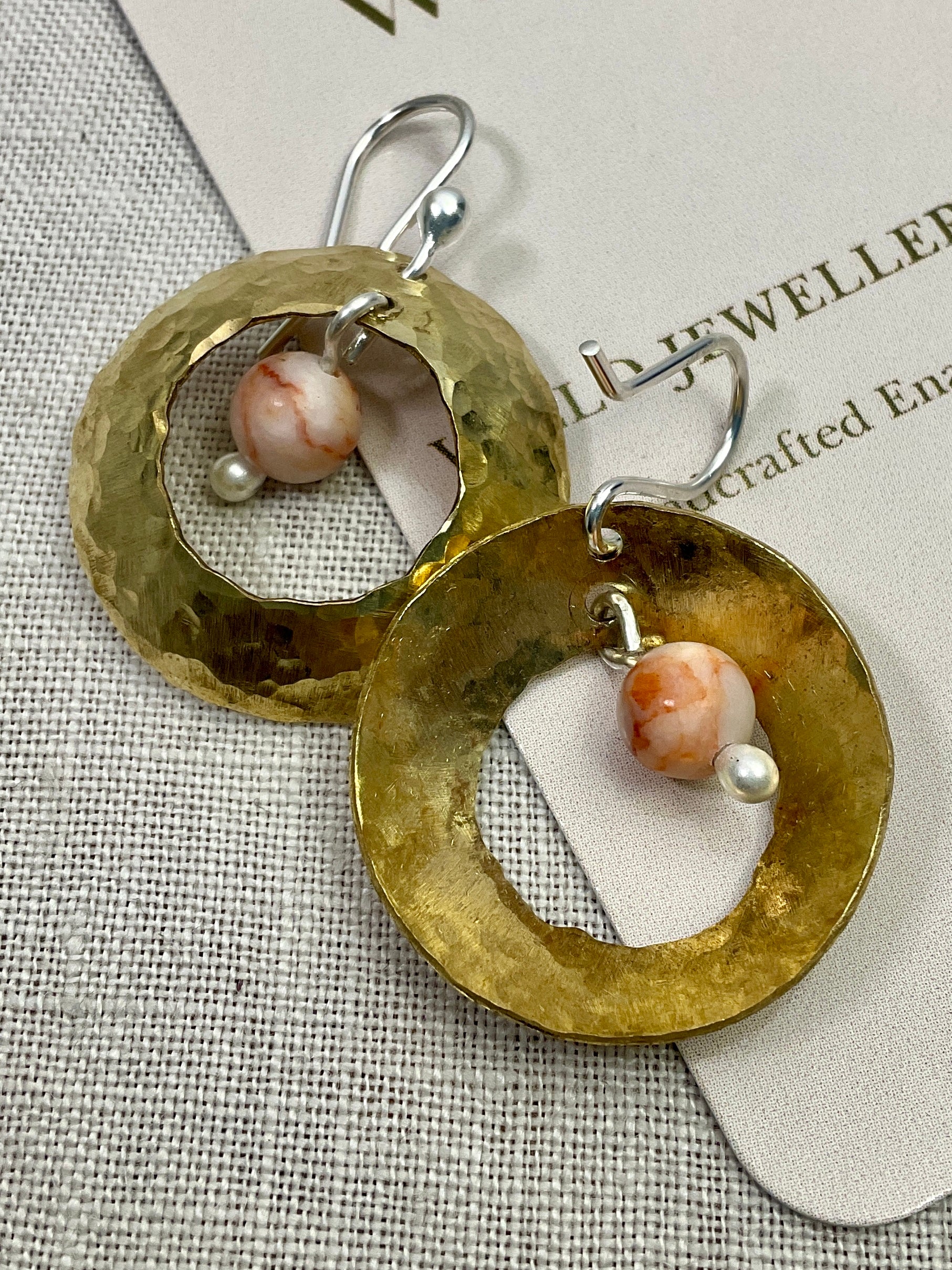 Brass domed earrings with gemstones.