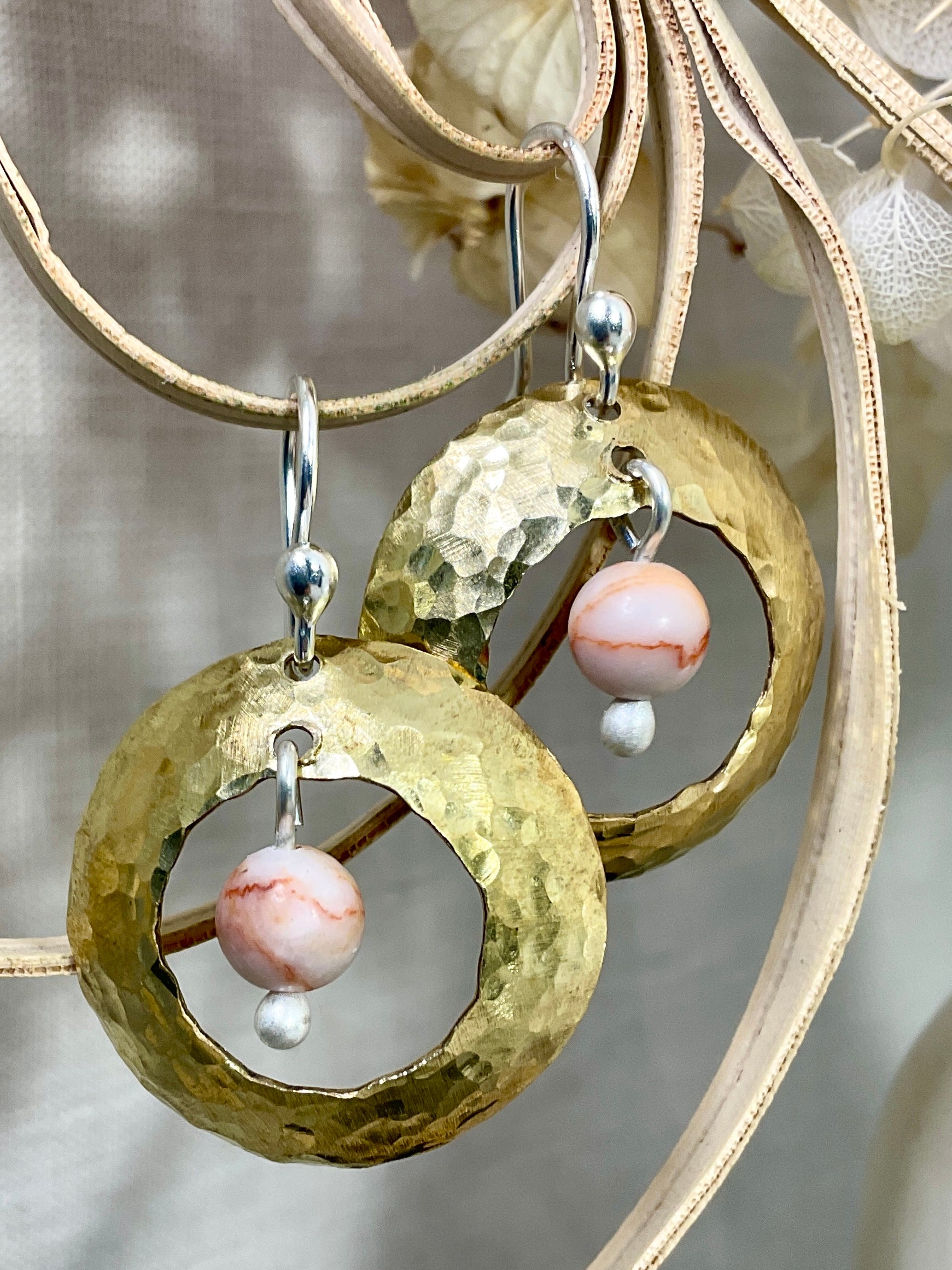 Brass domed earrings with gemstones.