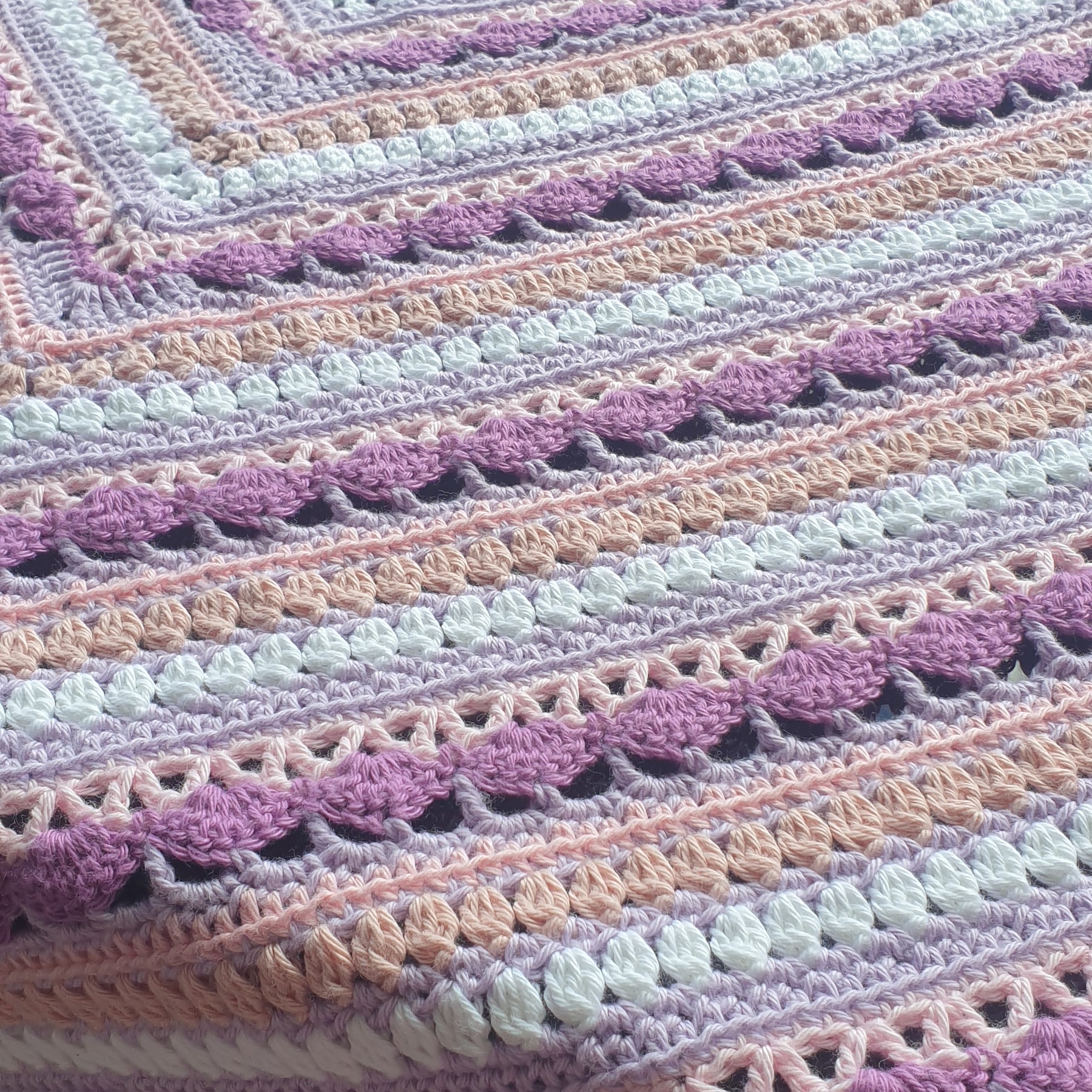 Beautiful crochet cotton afghan in pink/lilacs