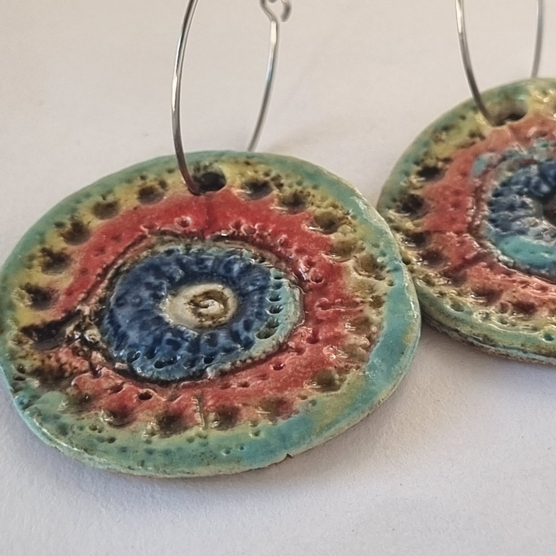 Handmade Stoneware Ceramic Earrings, blue-orange-green multi-coloured, 35mm diameter, pierced ears
