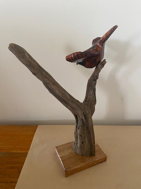 Handcarved wren in flight