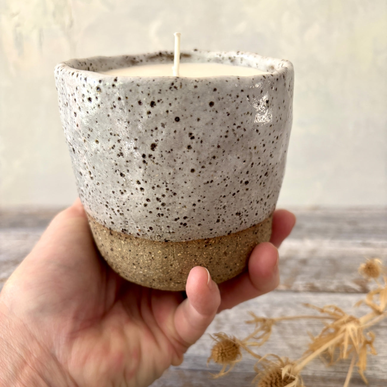 Rustic and white speckled ceramic soy candle