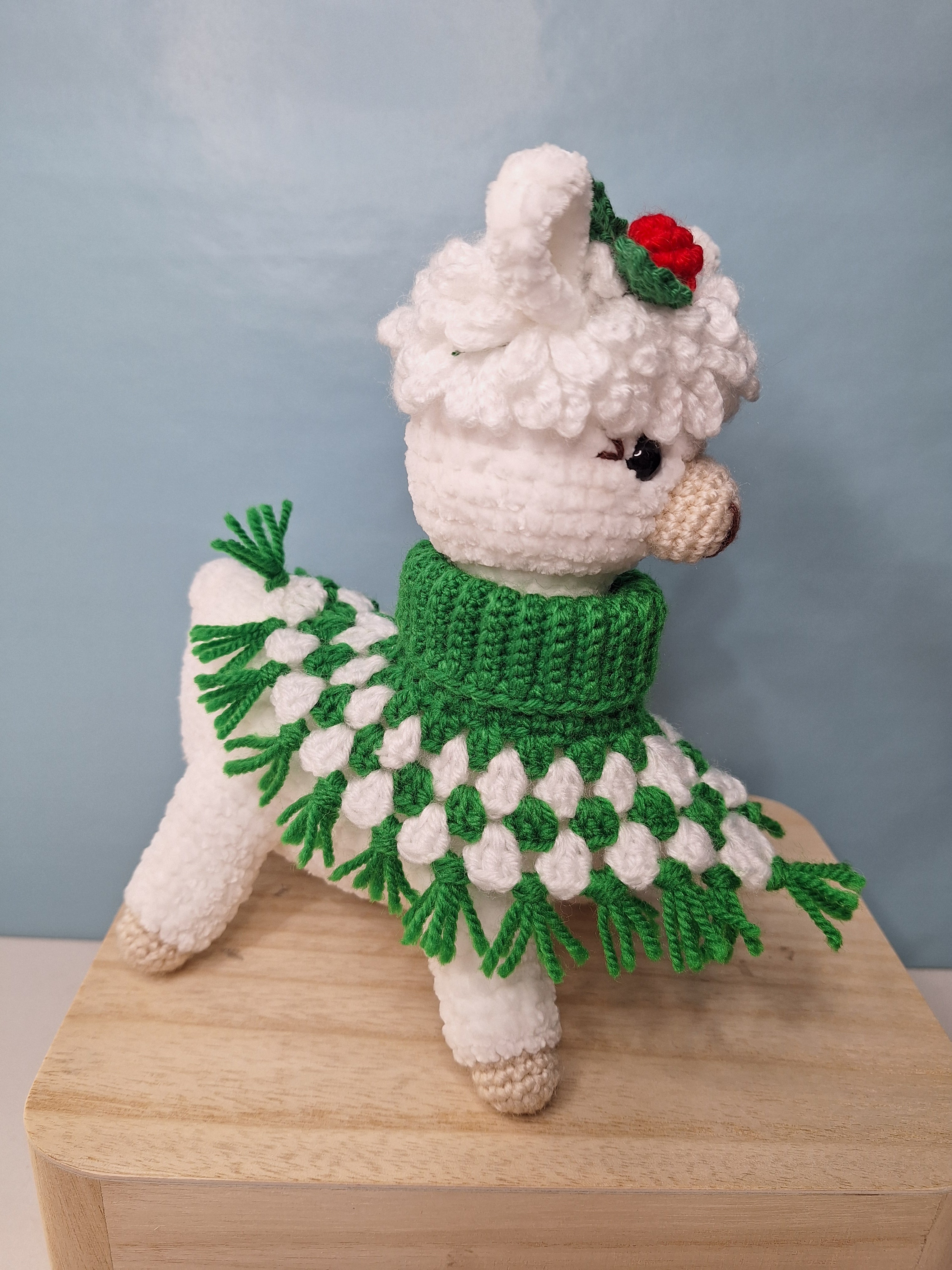 Crocheted Christmas Alpaca wearing a Poncho