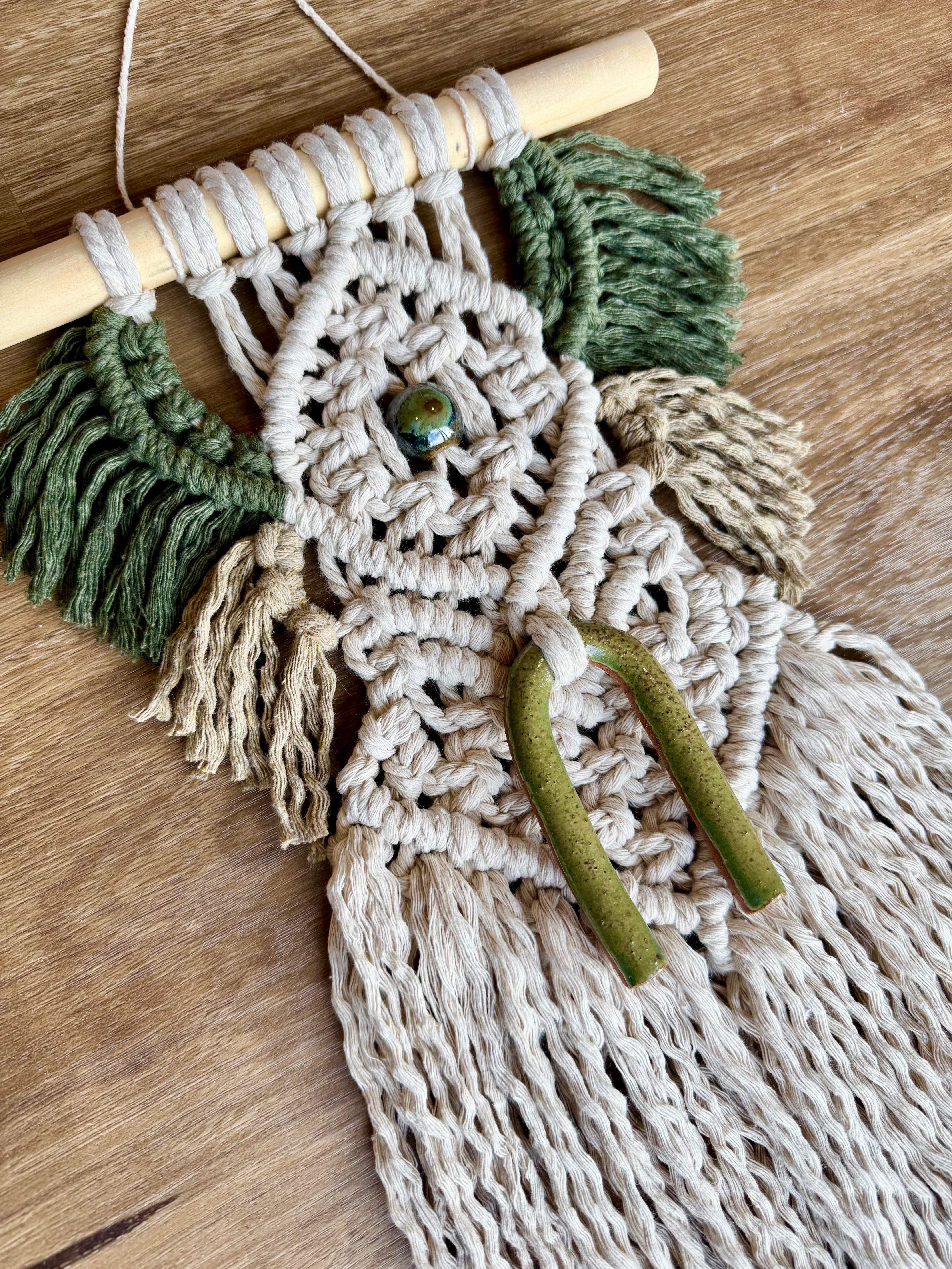 Macrame wall hanging with clay bead detail